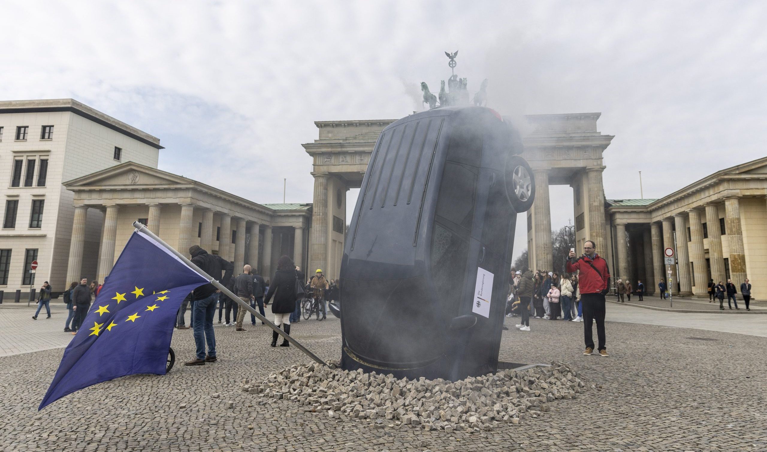 Activists protest against policy in favour of combustion-engine cars in the EU in front of Brandenburg Gate in the centre of Berlin (picture from 2023).
